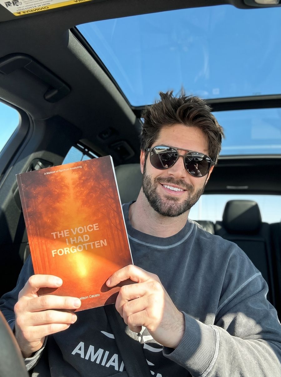 A reader with the book outdoors