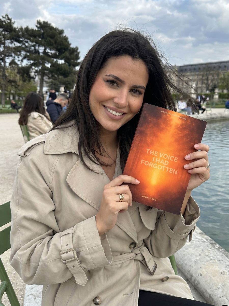 A reader holding The Voice I Had Forgotten in a park in Paris